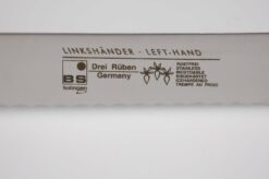 venstrehånds brødkniv med plastik håndtag til venstrehåndet